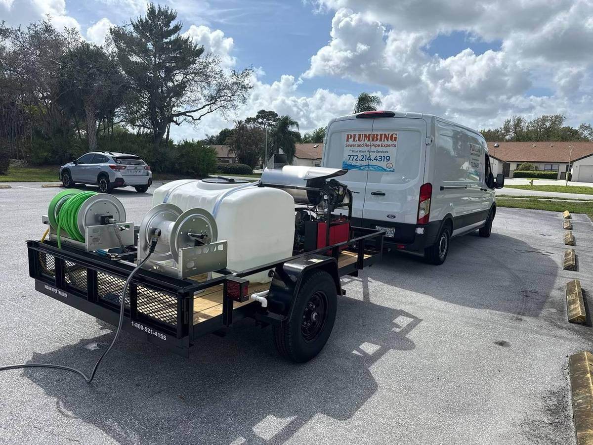 Blue Wave sewer jetting trailer and service van