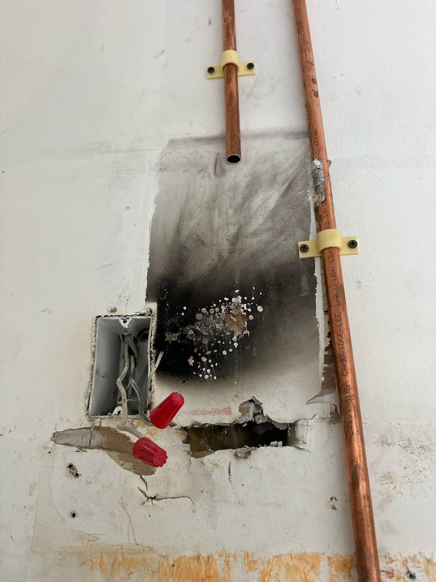 Plumber performing water leak detection in a Palm City, FL home — photo 1