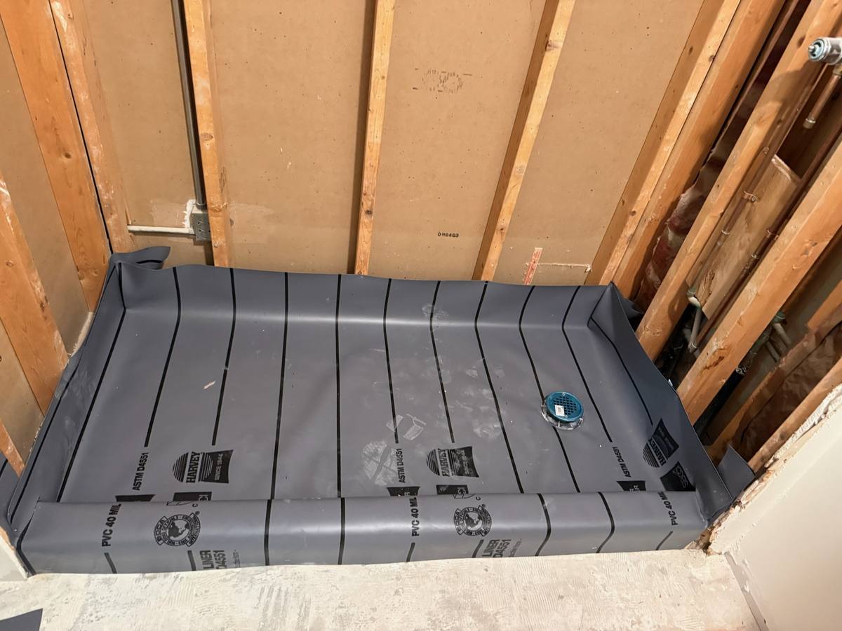 Bathroom remodel plumbing with a new shower pan liner installed in Palm City, FL — photo 3