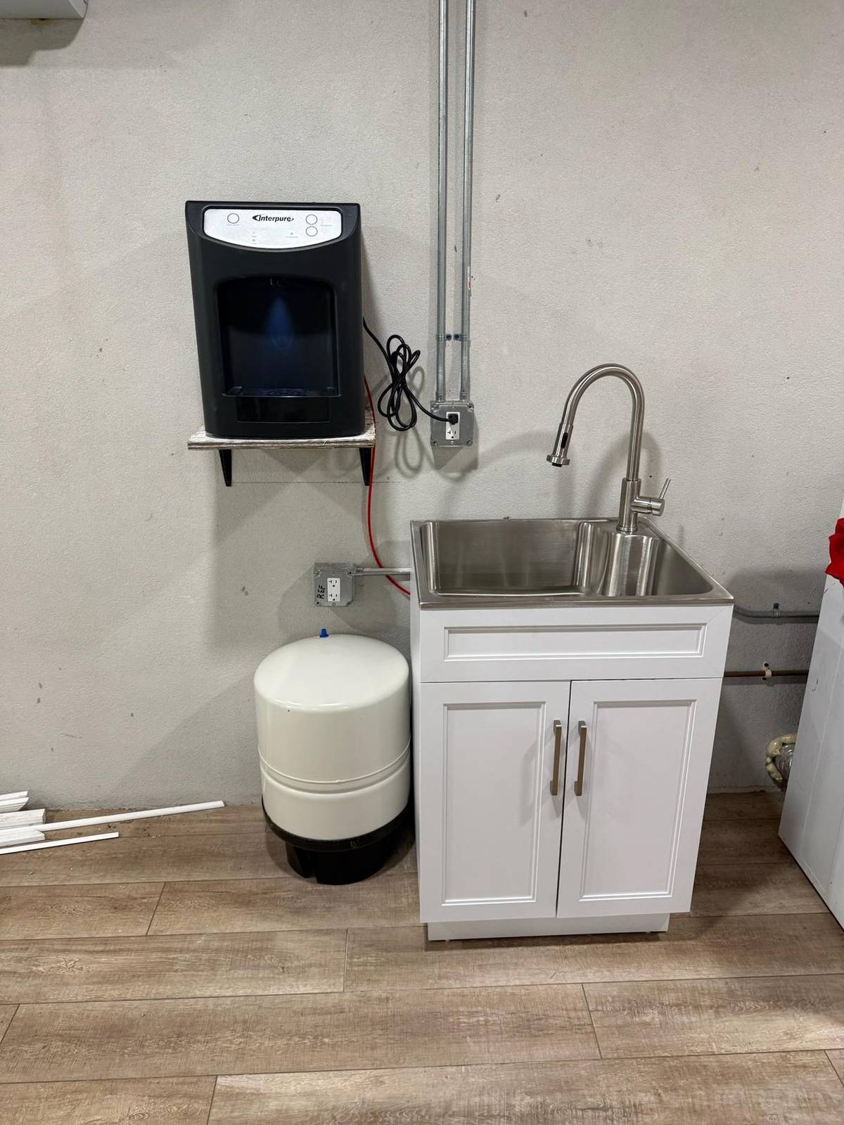 Plumber installing a new kitchen faucet in Palm City, FL